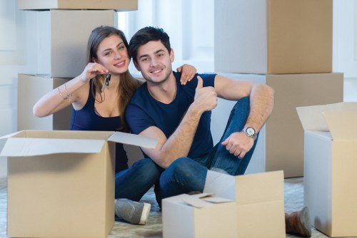 Local house removalists working in Kentish Town with moving boxes and furniture