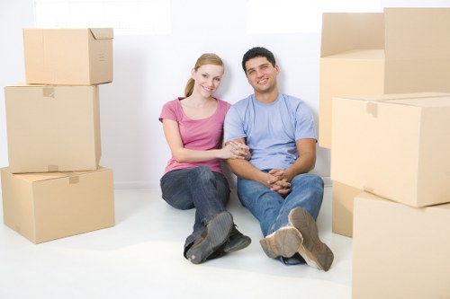 Furniture removals team planning a move in a Kentish Town street