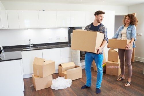 Packed office equipment and furniture ready for transport