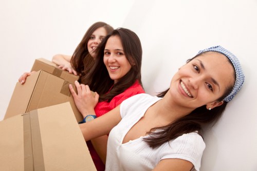 Team managing furniture and stair access during a Kentish Town home relocation