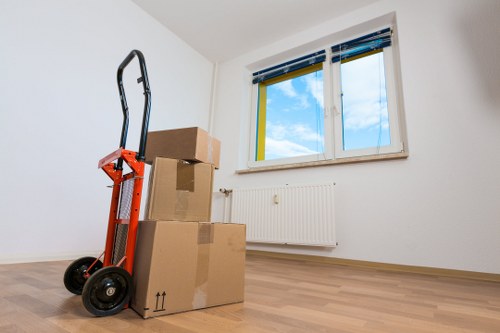 Kentish Town commercial relocation with furniture carefully moved through a building entrance
