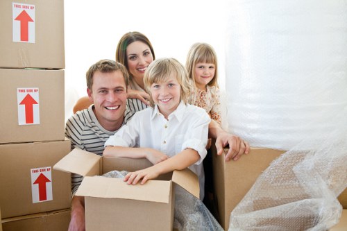 Moving crew preparing furniture for transport in a Kentish Town same day removal