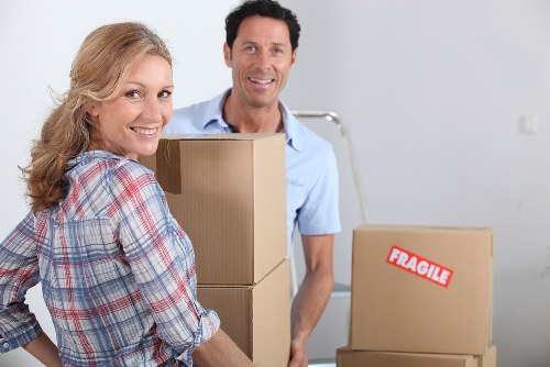 Local movers organising boxes in a Kentish Town flat with narrow access